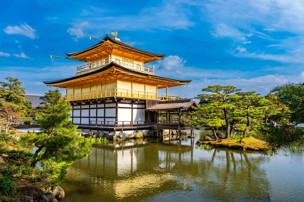golden pavilion over pond kyoto