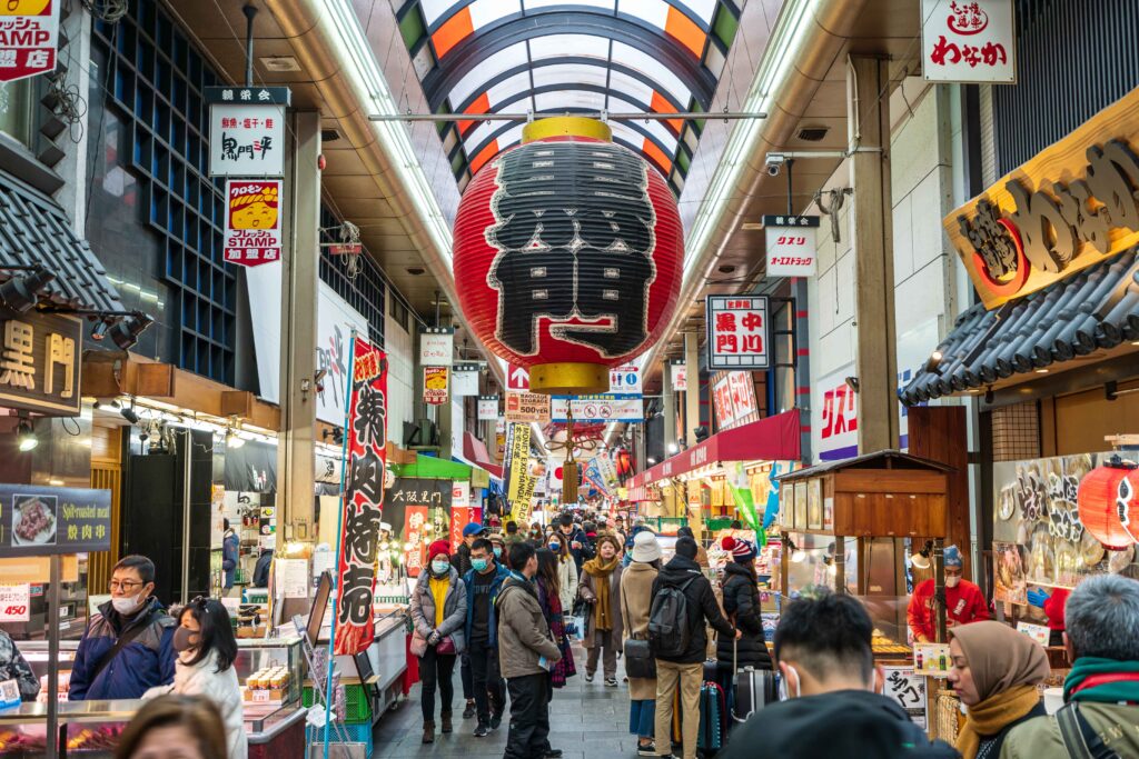 people walking through kuremon food market